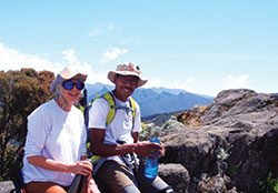 Dee Anne and Paul Sinclair, teachers at Father Thomas Scecina Memorial High School in Indianapolis, smile before their climb up Mount Kilimanjaro in Tanzania in eastern Africa during the summer of 2018. The Sinclairs were able to take part in their adventure thanks to two grants awarded through the Lilly Endowment’s Teacher Creativity Fellowship program, a program that helps “educators to pursue their dreams and passions.” (Submitted photo)