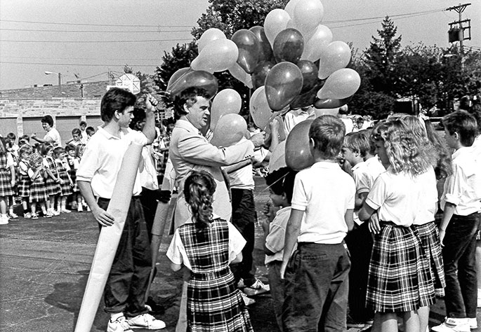 This photo from Sept. 8, 1989, shows Holy Spirit School in Indianapolis celebrating the 40th anniversary of its founding. School principal Kent Schwartz distributed balloons to five students from each grade level at the school, for a total of 40 balloons. The balloons were released following an all-school Mass.