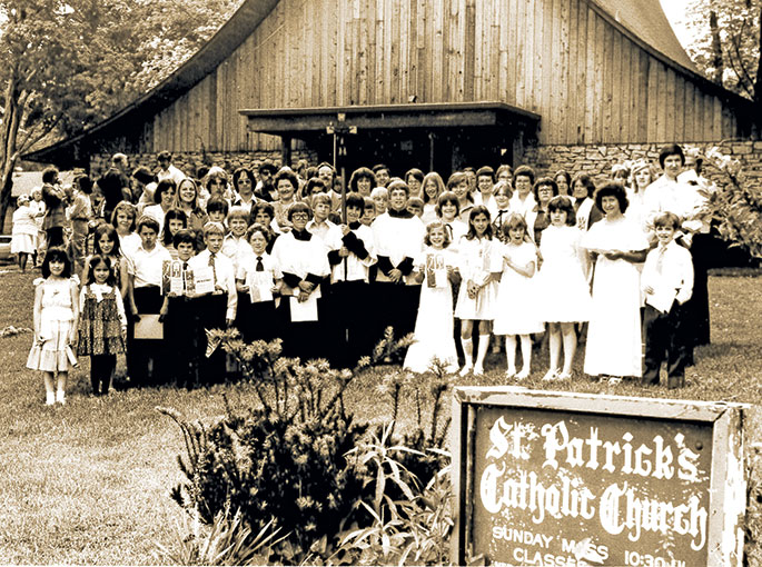 In this photo from June 1, 1979, a group of children who had recently received several sacraments along with their sponsors gather in front of St. Patrick Church in Salem. The group includes children who participated in the sacrament of penance for the first time, received their first Communion and those who received the sacrament of confirmation. St. Patrick Parish was founded in 1942 but moved into the church building shown here in 1975.