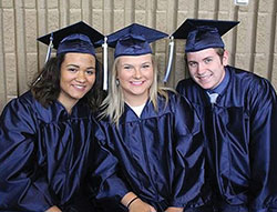 Marcella Murphy, left, Gabbi Roberts and Trey Crawford celebrate their 2018 graduation from Our Lady of Providence High School in Clarksville. (Submitted photo)