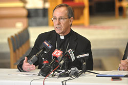 In an interview with The Criterion on July 1, Archbishop Charles C. Thompson discussed a range of issues in light of recent decisions by Cathedral High School and Brebeuf Jesuit Preparatory School, both in Indianapolis. Here, the archbishop speaks with Indianapolis media during a June 27 news gathering at SS. Peter and Paul Cathedral in Indianapolis. (Photo by Sean Gallagher)