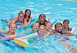 Campers enjoy a dip in the pool with their adult counselor at Camp Rancho Framasa in Brown County. (Submitted photo)