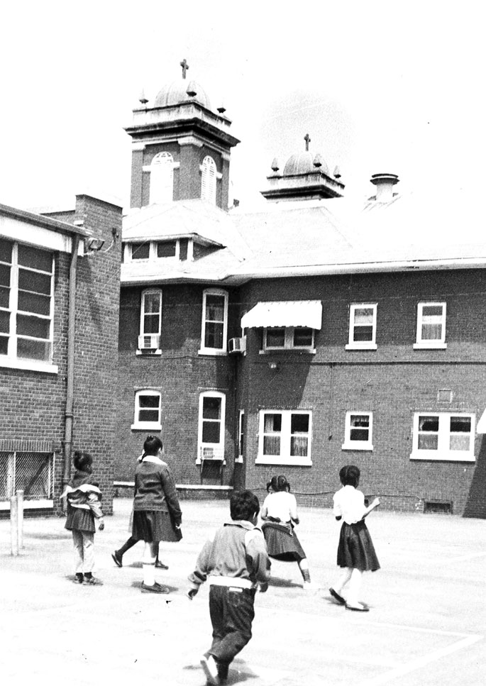 Students play outside during recess near the former St. Francis de Sales Church in Indianapolis in this photo from May 15, 1983. The former St. Francis de Sales Parish in the Brightwood neighborhood was founded in 1881 but closed on June 30, 1983, along with its school, due to declining membership caused by the construction of Interstate 70. The church building is now the home of the Father Boniface Hardin Gathertorium at Martin University. 