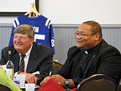 Bob Teipen and Father Douglas Hunter enjoy a table conversation during the 15th anniversary celebration of Catholic Radio Indy on Aug. 27. Teipen founded the company which owns and operates the station while Father Hunter was the keynote speaker at the event. (Submitted photo by Brigid Curtis Ayer)