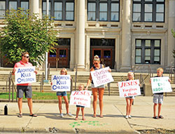 Denis, left, Ava, Raelyn, Buffy, Tessa and Carter O’Brien, members of St. Jude Parish in Indianapolis, give witness as a family along North Meridian Street in Indianapolis during the national LifeChain event on Oct. 7, 2018. (File photo by Natalie Hoefer)