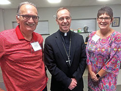 Tony Pizulo, left, and his wife, Marilyn Pizulo of Our Lady of the Springs Parish in French Lick, enjoy a visit with Archbishop Charles C. Thompson after the Sept. 19 United Catholic Appeal Mass and dinner at Our Lady of Perpetual Help Parish in New Albany. (Submitted photo by Leslie Lynch)