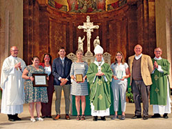Archbishop Charles C. Thompson is pictured in SS. Peter and Paul Cathedral in Indianapolis on Sept. 25 with archdiocesan staff and the winners of awards that were presented in the areas of Catholic education, catechesis and youth ministry. Pictured, left, SS. Peter and Paul rector Father Patrick Beidelman, who also serves as executive director of the Secretariat for Worship and Evangelization; education honoree Sarah Jean Watson; archdiocesan superintendent of schools Gina Fleming; director of the archdiocese’s Office of Youth Ministry Paul Sifuentes; youth ministry honoree Monica Robinson; Archbishop Thompson; catechesis honoree Marianne Hawkins; archdiocesan director of catechesis Ken Ogorek; and archdiocesan director of the Secretariat for  Pastoral Ministries Deacon Michael Braun. (Photo by John Shaughnessy)