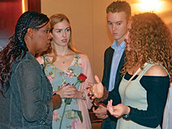 Pro-life advocate Star Parker speaks with Sally Jones, center, Daniel Hanes and Emma Lucchese after Right to Life of Indianapolis’ Celebrate Life Dinner in Indianapolis on Oct. 1. The three teens are seniors of North Central High School in Indianapolis. Sally, a member of Immaculate Heart of Mary Parish in Indianapolis, and Emma, a member of St. Luke the Evangelist Parish in Indianapolis, co-founded a pro-life club at the public school last year, along with their friend Margaret “Maggie” McPherson (not pictured), a member of St. Pius X Parish in Indianapolis. (Photo by Natalie Hoefer)