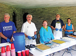 Members of the Indianapolis Serra Club assist in serving a meal at Bishop Bruté Days, an annual vocations camp and retreat for junior high and high school boys, held at Bishop Simon Bruté College Seminary in Indianapolis. They are, from left, Rick Santangelo, Jim Cain, Louise Collet and Joe Dwenger. Also pictured is Ann Berkemeier, right, the wife of Serran Art Berkemeier. She often assists at club events. (Submitted photo)