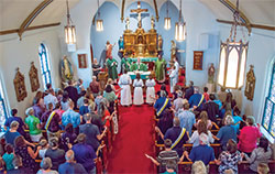 Archbishop Charles C. Thompson leads members of St. Thomas the Apostle Parish in Fortville in prayer during a Sept. 14 Mass to celebrate the 150th anniversary of the founding of the faith community. (Submitted photos)
