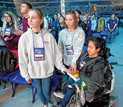 Youths from the Diocese of Des Moines, Iowa, have a good time together performing karaoke in the thematic village in the Indiana Convention Center at the National Catholic Youth Conference in Indianapolis on Nov. 21. (Photo by John Shaughnessy)