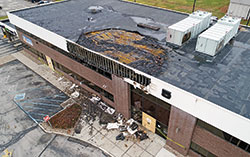This overhead drone shot on Dec. 1 shows damage to an office building on the northwest side of Indianapolis that occurred late on Nov. 30. Two pro-life organizations were affected. 1st Choice for Women, which offers free peer-counseling, pregnancy tests and ultrasounds, is located below the second-floor area where the fire started. Magnificat Family Medicine is located on the second floor to the right of the fire damage. (Submitted photo by Colin Landberg/Pike Township Fire Department)