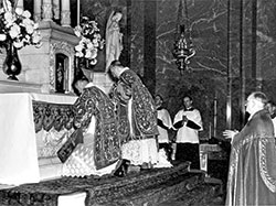 Archbishop Amleto G. Cicognani, center, celebrates a Mass on Dec. 19, 1944, in SS. Peter and Paul Cathedral in Indianapolis after the formal implementation of a decree of Pope Pius XII raising the then-Diocese of Indianapolis to an archdiocese. Archbishop Joseph E. Ritter, who became the first archbishop of Indianapolis the same day, is seen at right. He had been installed as bishop of Indianapolis in 1934. Archbishop Cicognani was apostolic delegate to the United States from 1933-58. (Archive photo)