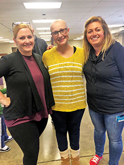 During a difficult period in her family’s life, Norah Kinderman, center, and her family have been blessed by the caring efforts of her former high school classmates, including Patty Belden, left, and Kelly Duggins. (Submitted photo)