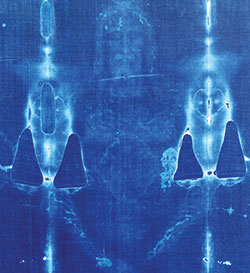 This color negative of the Shroud of Turin is taken from the original photograph shot by Barrie Schwortz in 1978 and includes places where the relic was damaged in a fire. Schwortz was the official documenting photographer for the Shroud of Turin Research Project in 1978—the first extensive scientific examination of one of the holiest relics of Christendom, which is housed in the Turin Cathedral in Italy. (©1978 Barrie M. Schwortz Collection, STERA, Inc.)