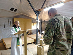 Father Adam Ahern celebrates Mass on Feb. 8 for soldiers on a military base in Jordan. There is no regular chaplain serving the region, and the soldiers appreciate when a chaplain visits. (Submitted photo)