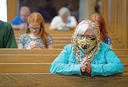 Susie Dickman, prays after receiving Holy Communion at St. Louis Church in Batesville on May 23. (CNS photo/Katie Rutter)