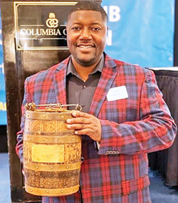 Chris Beaty poses with the Old Oaken Bucket, a reminder of his days as a football player for Indiana University. Beaty died on May 30, trying to help two women being attacked in downtown Indianapolis. (Submitted photo)