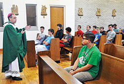 Archbishop Charles C. Thompson delivers a homily during a June 26, 2018, Mass at Bishop Simon Bruté College Seminary in Indianapolis that was part of Bishop Bruté Days. It is an annual event sponsored by the archdiocesan vocations office for teenage boys open to a vocation to the priesthood. Bishop Bruté Days will take place this year on July 10 at the seminary. (File photo by Sean Gallagher)