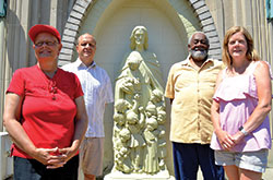 Patrice Payne, left, Tim Nation, Joseph Smith and Eileen Walthill are some of the members of the Race and Culture Committee at St. Thomas Aquinas Parish in Indianapolis that has strived to increase diversity in the parish and improve race relations in the community. (Photo by John Shaughnessy)