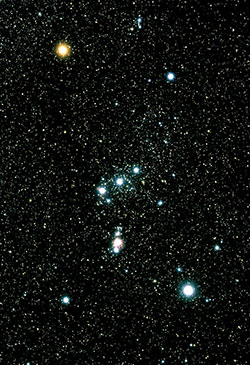 This ground-based image of the Constellation of Orion shows the “belt” and “sword” that together loosely form the capital letter “T.”  The fuzzy, red star near the middle of the sword is actually the Orion Nebula, and the bright light at its the bottom is Iota Orionis. (Photo credit: Akira Fujii)