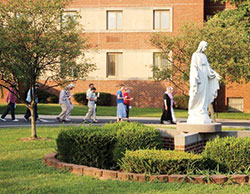 Benedictine sisters process in prayer on Aug. 25, the date of a federal execution, outside Our Lady of Grace Monastery in Beech Grove. The monastery is closed to visitors due to the coronavirus pandemic, but the sisters are finding ways to continue the work of prayer and social justice. (Submitted photo)
