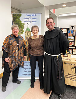 As the vocation director of the Franciscan Sisters of Oldenburg, Franciscan Sister Kathleen Branham, left, works to draw women to the wonderful life she has known as a religious sister. Here, she poses for a picture with Franciscan Sister Olga Wittekind and Franciscan Brother Joseph Bach during a Vocation Fair in Brooklyn, N.Y. (Submitted photo)