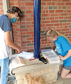 Axle, left, and Charlotte Pflum participate in a Bible scavenger hunt hosted by St. Gabriel Parish in Connersville. Parish catechetical leaders are seeking out creative ways to keep kids engaged in their faith even as families deal with health concerns during the coronavirus pandemic. (Submitted photo)