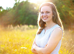 Photo: St. Joan of Arc parishioner Perry Langley’s story of faith and transformation began as a teenager at a “Consumed” retreat that especially touched and changed her. (Submitted photo courtesy of Andrea Kuhn Photography)