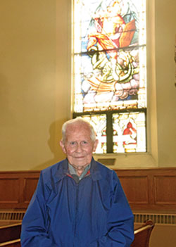 Lou Moster, a member of St. Michael Parish in Brookville, poses on Dec. 2, 2020, in the Batesville Deanery faith community’s church. At 92 and a lifelong member of the parish, Moster has experienced more than half of its 175-year history. (Photo by Sean Gallagher)