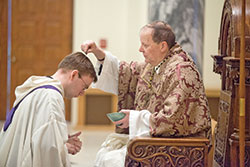 Benedictine Archabbot Kurt Stasiak sprinkles ashes on the head of Benedictine Father Thomas Griscoski during an Ash Wednesday Mass on March 1, 2017, in the Archabbey Church of Our Lady of Einsiedeln in St. Meinrad. Since its founding in 1854, the monks of Saint Meinrad Archabbey have followed the older custom in the Church of sprinkling ashes on the top of the head on Ash Wednesday. (Photo courtesy of Saint Meinrad Archabbey)