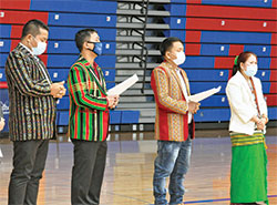 Paul San, left, Francis Tauksang, Paul Hnin and Kho Va prepare to read petitions in the auxiliary gym of Roncalli High School in Indianapolis during a Feb. 11 prayer service for the people and nation of Myanmar following a military coup there on Feb. 1. Hnin, is a member of St. Barnabas Parish in Indianapolis. (Photo by Natalie Hoefer)