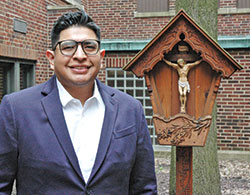 As the coordinator of Hispanic Ministry for the archdiocese, Saul Llacsa has drawn upon his mother’s wisdom to lead people closer to God. (Photo by John Shaughnessy)