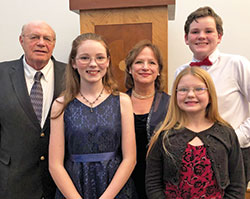 Evan and Jo Griffiths pose for a family photo with their three great-grandchildren, Mykiah, 16, Aidan, 14, and Lola, 13. Members of SS. Francis and Clare of Assisi Parish in Greenwood, the Griffiths were able to give their great-grandchildren a Catholic education at the parish school with the help of Indiana’s Choice Scholarship Program, more commonly known as the voucher program. (Submitted photo)