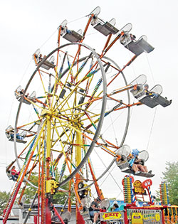People ride a ferris wheel on May 15 at the St. Joseph Parish Festival in Shelbyville. (Photo by Sean Gallagher)