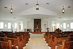 The most striking features of the new Holy Angels Church in Indianapolis are the openness of the space and how light pours through its large windows. The church was dedicated on June 9, the culmination of a nine-year journey for the parish. (Photo by John Shaughnessy)