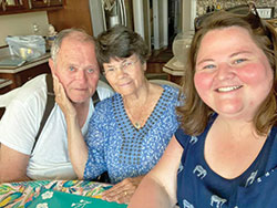 Megan Gehrich poses for a photo with her grandparents, Ed and Sandy Gehrich of St. Rose of Lima Parish in Franklin. (Submitted photo)