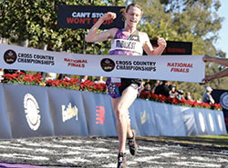 Cole Hocker, then a student at Cathedral High School in Indianapolis, crosses the finish line at the National Cross Country Race in 2018. (Photo courtesy runnerspace.com.)