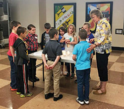 Cathy Andrews helps prepare children for their first Communion at St. Vincent de Paul Parish in Bedford. (Submitted photo)