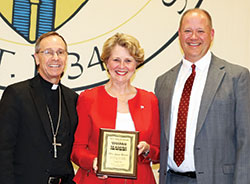 Former U.S. Rep. Susan Brooks poses with Archbishop Charles C. Thompson, left, and Marion County Superior Court Judge David Certo after receiving the Woman for All Seasons Award bestowed upon her by the Saint Thomas More Society of Central Indiana during a reception at the Archbishop Edward T. O’Meara Catholic Center in Indianapolis on Oct. 5. (Submitted photo by Kim Pohovey)