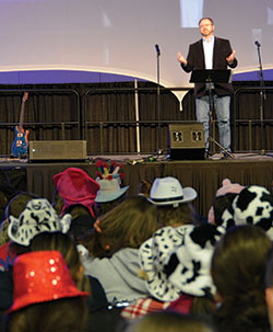 Dr. Bradley Gregory, assistant professor of biblical studies at The Catholic University of America in Washington, talks to youths at the National Catholic Youth Conference about the compatibility of faith and science in the Indiana Convention Center in Indianapolis on Nov. 19. (Photo by Natalie Hoefer)