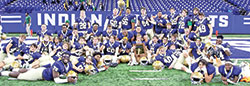 The seniors on the football team of Cathedral High School in Indianapolis share the joy after their squad won the Indiana High School Athletic Association’s Class 5A state championship on Nov. 26 at Lucas Oil Stadium in Indianapolis. (Submitted photo)