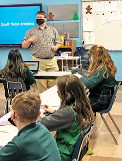 Richard Pangburn teaches a middle school social studies class at St. Vincent de Paul School in Bedford. (Submitted photo)