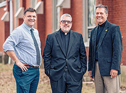 Father Michael Shawe Memorial Jr./Sr. High School in Madison has been blessed to have three of its graduates return to their alma mater in leadership roles: principal Curt Gardner, left, chaplain Father Christopher Craig and president Philip Kahn. (Photo courtesy of Laura J. Gardner)