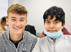 The smiles show the bond that has formed between Logan Cucuz, a freshman at Marian University in Indianapolis, and Sebastian, a sixth-grade student at Holy Angels School in Indianapolis, through the College Mentors for Kids program. (Photo by John Shaughnessy)
