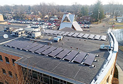 Recently installed solar panels sit on the roof of Cardinal Ritter Jr./Sr. High School in Indianapolis. In addition to reducing the school’s carbon footprint and utility costs, the panels are being integrated into its science and theology lesson plans. (Submitted photo)