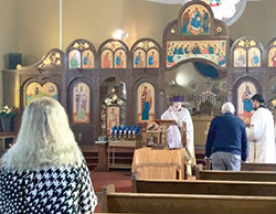 Father Bryan Eyman, pastor of St. Athanasius the Great Byzantine Catholic Church in Indianapolis, an Eastern Catholic faith community that is part of the full communion of the Catholic Church, leads worshipers in a prayer for safety, peace and justice in Ukraine on Feb. 27. (Screen shot courtesy of St. Athanasius the Great Catholic Church video on Facebook)