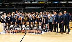The boys’ basketball team of Our Lady of Providence High School in Clarksville celebrates its first state championship on March 26 at Gainbridge Fieldhouse in Indianapolis. (Photo courtesy of Charles Kraft)