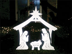 A light illuminates a Nativity scene on a December night. (Criterion file photo by Mike Krokos)