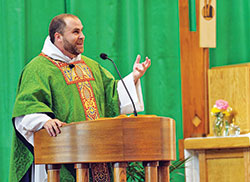 Dominican Father Patrick Hyde delivers a homily at St. Paul Catholic Center in Bloomington on Nov. 29, 2021. (Submitted photo by Katie Rutter)